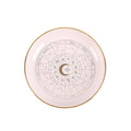 Plat à babioles en forme de roue astrologique blanc cassé