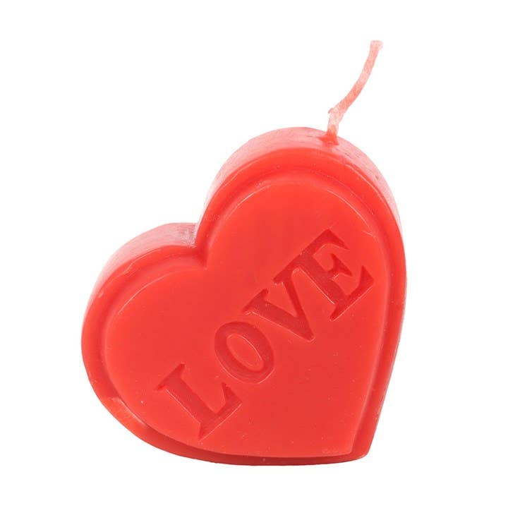 Red heart-shaped Valentine's Day candle