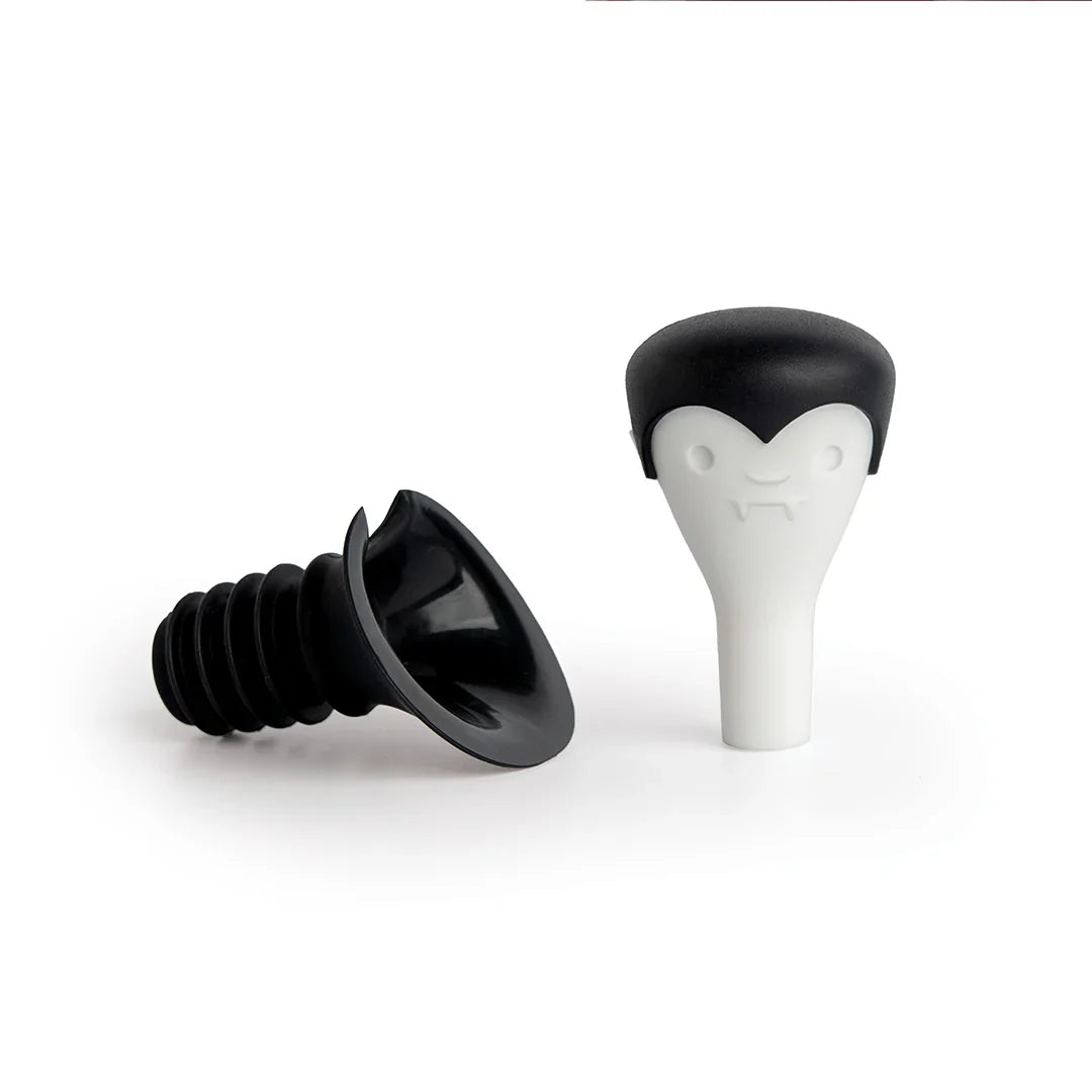 Count Corkula bottle stoppers have vampire fangs and black caps, perfect for wine enthusiasts.