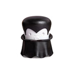 A cartoon vampire with a cape and fangs holds an OTOTO Gracula garlic crusher.