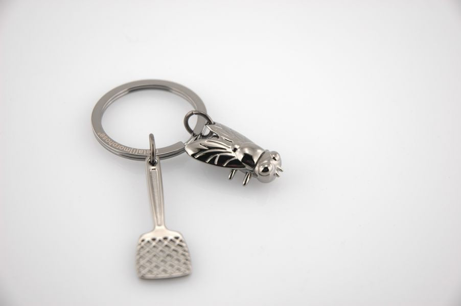 Regalo de diseño – porte cles tapette a mouche metalmorphose 