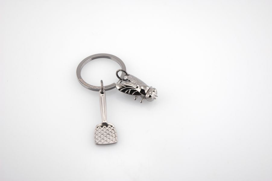 Regalo de diseño – porte cles tapette a mouche metalmorphose 