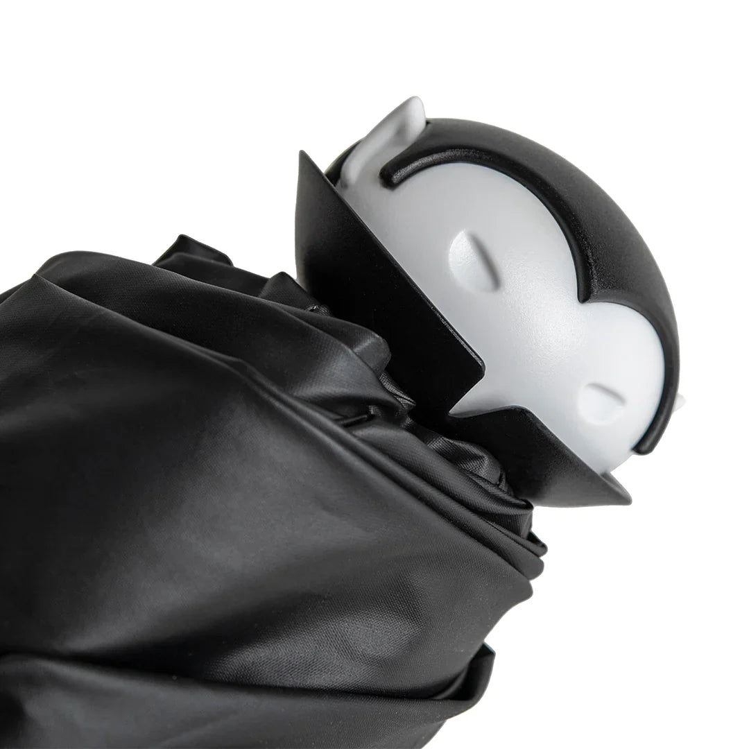 Spookula: A black-and-white vampire figure with closed eyes, wrapped in black cloth.