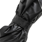 The Spookula is a stylish black umbrella with a Velcro strap, perfect for any weather.