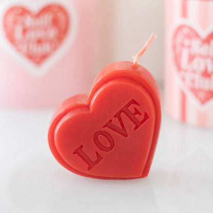 Red heart-shaped Valentine's Day candle
